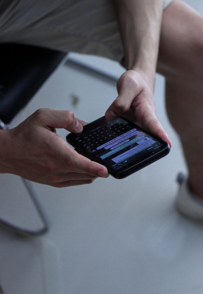 person-holding-black-iphone-4-pjojga8eovq person-holding-black-iphone-4-pjojga8eovq
